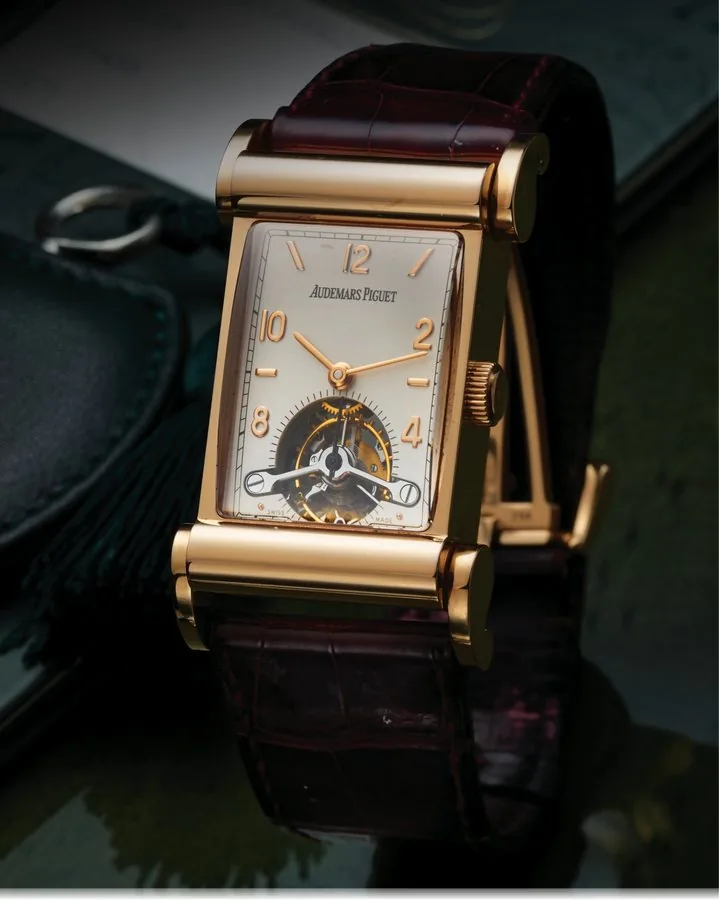 AUDEMARS PIGUET REF. 25876OR TOURBILLON PINK GOLD Audemars Piguet, Genève , " Canapé Tourbillon", No. 21/25, No. 472689, case No. D 95486, Ref. 25876OR. Made in a limited edition of 25 examples in 2000. Very fine, very rare and unusual, rectangular, 18K pink gold wristwatch with visible one-minute tourbillon regulator and an 18K pink gold Audemars Piguet deployant clasp. Accompanied by the fitted box, certificate of origin and key.