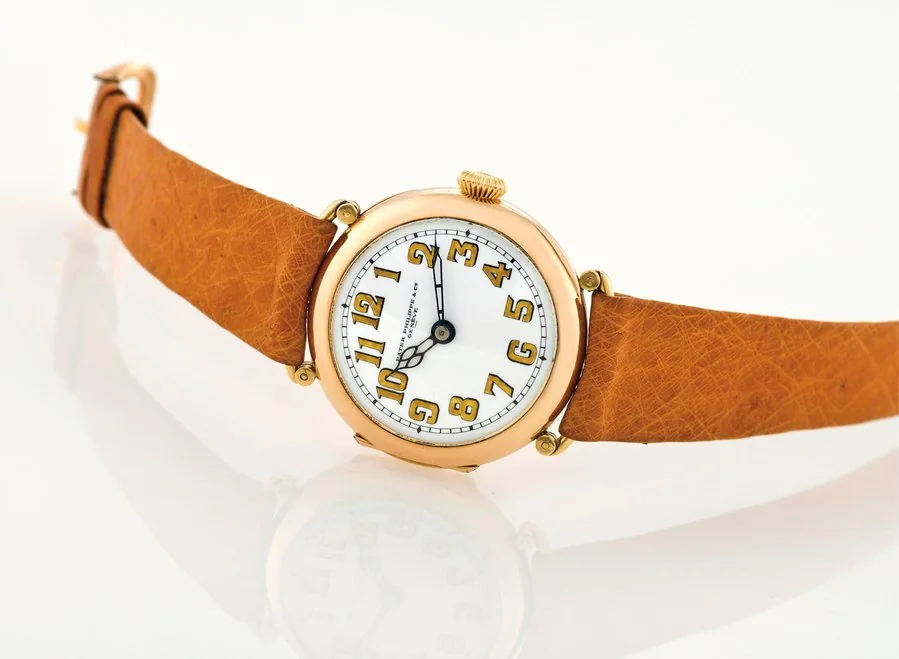 PATEK PHILIPPE YELLOW GOLD OFFICIER Patek Philippe & Cie/ Bailey Banks and Biddle Co, Genève, No. 120013, case No. 120013. Made in 1902, sold on June 4th 1903. Very fine and rare 18K yellow gold "Officier" wristwatch. Accompanied by the Extract from the Archives.