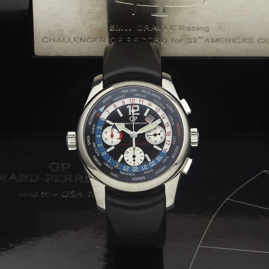 GIRARD-PERREGAUX REF. 49800 USA 76 WORLD TIME CH RONOGRAPH, STEEL Girard-Perregaux, "USA 76 World Time Chronograph, GGYG, Challenger of Record" No. 480/750, Ref. 49800. Made in a limited edition of 750 examples in 2007 for the America's Cup 2007 "BMW Oracle Racing" sailing team. Fine, oversized, world time, self-winding, water-resistant, stainless steel wristwatch with square button chronograph, registers, date and a stainless steel Girard- Perregaux double deployant clasp. Accompanied by the or