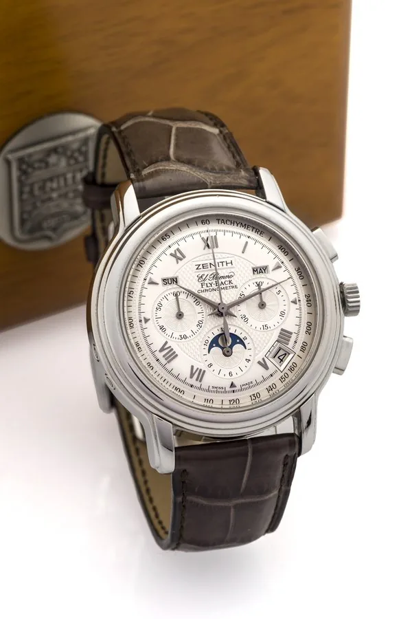 ZENITH EL PRIMERO CHRONOMASTER STEEL, NEW OLD STOCK Zenith, "El Primero, Chronometre", Ref. 03 1240 4001. Made in the late 1990's. Very fine, self-winding, water resistant, stainless steel wristwatch with square button chronograph, registers, tachometer, moon phases, triple date and a stainless steel Zenith double deployant clasp. Accompanied by the original fitted box, service booklet and hang tag.