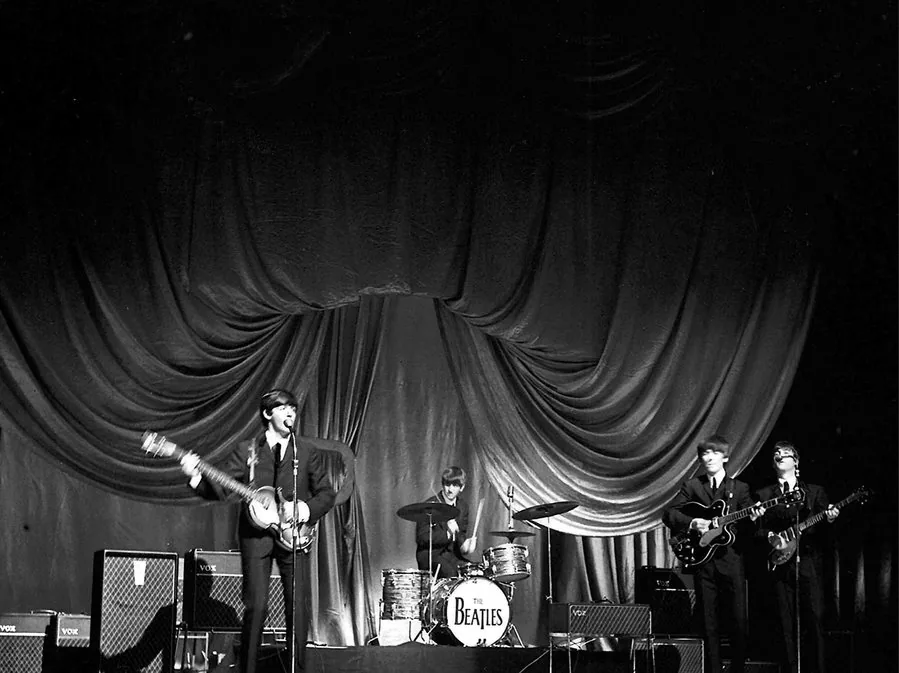 THE BEATLES ONSTAGE, SUNDERLAND, ENGLAND, 1963 Empire Theatre, February 9 LINER NOTES The Beatles were bottom of the bill on a Helen Shapiro tour. -Ian Wright SPECIFICS Press Camera VN, 5x4 Plate Camera, Glass Negative SIZE 16" x 20" MEDIUM Archival digital print. VALUE $800 - $975 STARTING BID $625