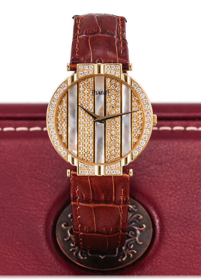 PIAGET REF. 8420 LADY'S POLO DIAMOND MOTHER OF PEARL AND YELLOW GOLD Piaget, Genève, "Polo", case No. 498776, Ref. 8675. Made in the 1980's. Fine and elegant, 18K yellow gold, diamond and mother of pearl lady's quartz wristwatch with an 18K yellow gold Piaget buckle. Accompanied by a Piaget box.