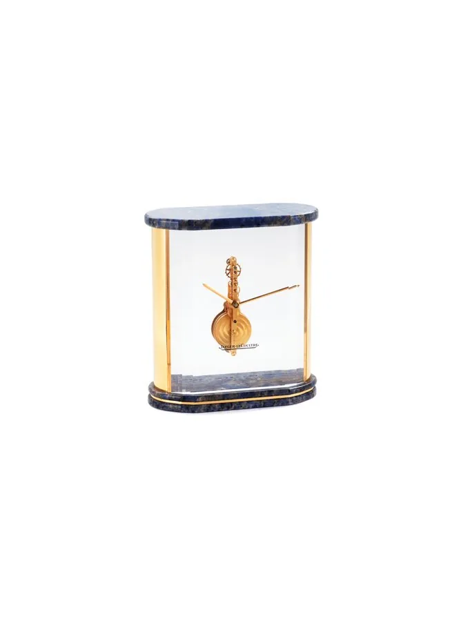 JAEGER LECOULTRE DESK CLOCK Jaeger-LeCoultre, Made in the 1970's. Fine, plastic and gilt brass, 8-day going desk clock with visible movement.