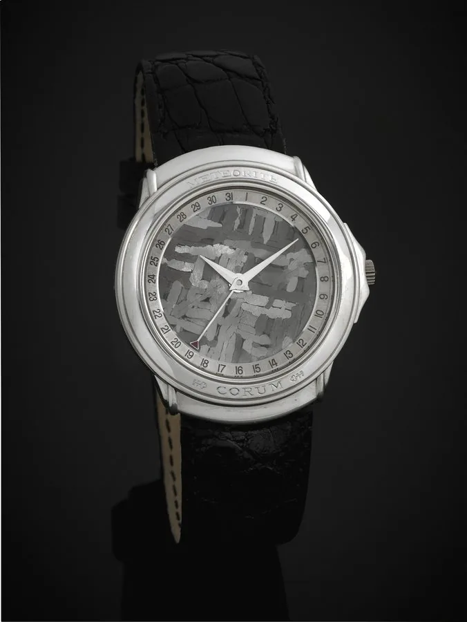 CORUM REF. 88.450.70 METEORITE DIAL, PLATINUM, Corum, Meteorite, case No. 525969, Ref. 88.450.70, No. 156. Made in the late 1990s. Very fine, rare and interesting, thin, self-winding, waterresistant, platinum wristwatch with date, meteorite dial and a platinum Corum buckle. Accompanied by a fitted box.