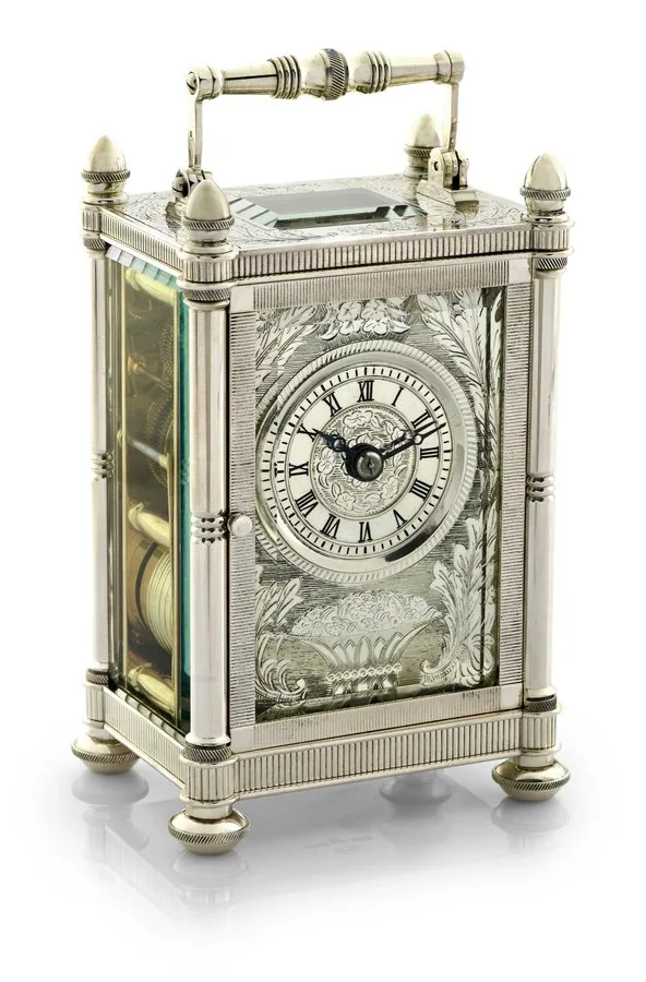 MAPPIN & WEBB LIMITED EDITION SOLID SILVER CARRIAGE CLOCK Mappin & Webb, London, No. 181/200. Made in a limited edition of 200 pieces to celebrate the Bi-Centenary of the company in 1975. Fine, solid silver cased, fusee-driven, 8-day going, hour and half-hour striking carriage clock. Accompanied by the original fitted box and key. To be sold without reserve