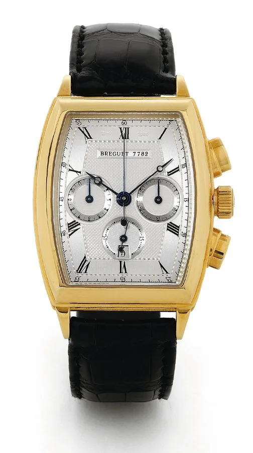 Heritage Chronograph Breguet, "Heritage Chronograph," No. 7782, Ref. 5460. Made circa 2002. Very fine, tonneau-shaped and curved, self-winding, water-resistant, 18K yellow gold wristwatch with olive-shaped button chronograph, registers, date and an 18K yellow gold Breguet deployant clasp. Accompanied by a Certificate of Origin and instructions.