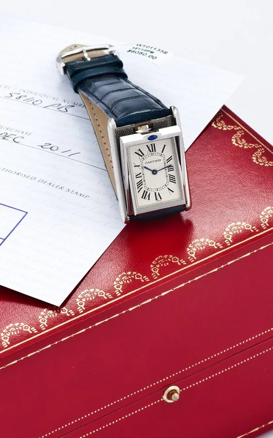 CARTIER, REF. 2390, TANK BASCULANTE MECHANIC STEEL Cartier, Swiss, Reversible Basculante, case No. 58110 PB, Ref. 2390. Sold on December 15th, 2011. Fine and unusual, rectangular, stainless steel wristwatch with cabriolet pivoting system and a stainless steel Cartier buckle. Accompanied by a fitted box, certificate and booklets.