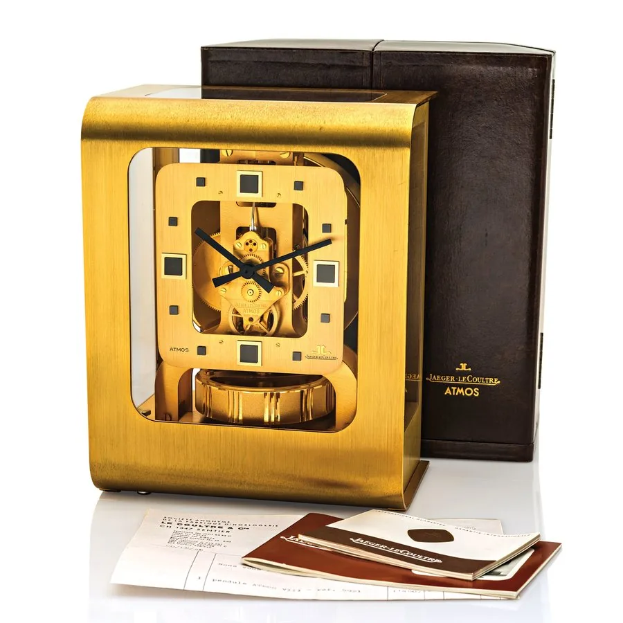 JAEGER-LECOULTRE ATMOS SO-CALLED "PACO RABANNE/COLANI" Jaeger-LeCoultre, "Atmos so-called Paco Rabanne", No. 430276, Ref. 5921. Sold in March 1975. Fine and very rare, modern rectangular, brushed gilt brass and plastic Atmos clock wound by barometric pressure changes. Accompanied by the original fitted box, warranty and instruction booklet.