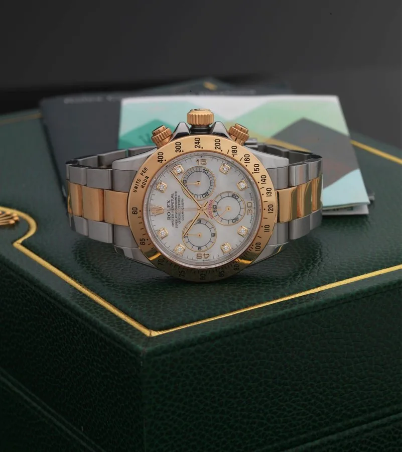 ROLEX REF. 116523 DAYTONA STEEL & GOLD MOP DIAMOND DIAL Rolex, Oyster Perpetual, Superlative Chronometer, Officially Certified, Cosmograph Daytona, case No. Y397386, Ref. 116523. Made in 2003, sold April 7th, 2004. Very fine, water-resistant, self winding stainless steel and 18K yellow gold chronometer wristwatch with mother-ofpearl diamond dial, round button chronograph, registers, tachometer and a stainless steel and 18K yellow gold Rolex Oysterlock bracelet. Accompanied by the original fitted