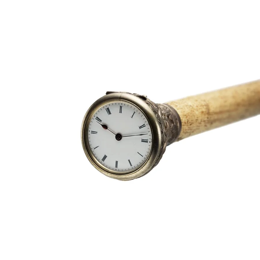 UNSIGNED BONE WALKING STICK WITH WATCH Unsigned, Made in the early 20th Century. A walking stick with main body in bone and key-wound watch on top in silver case.
