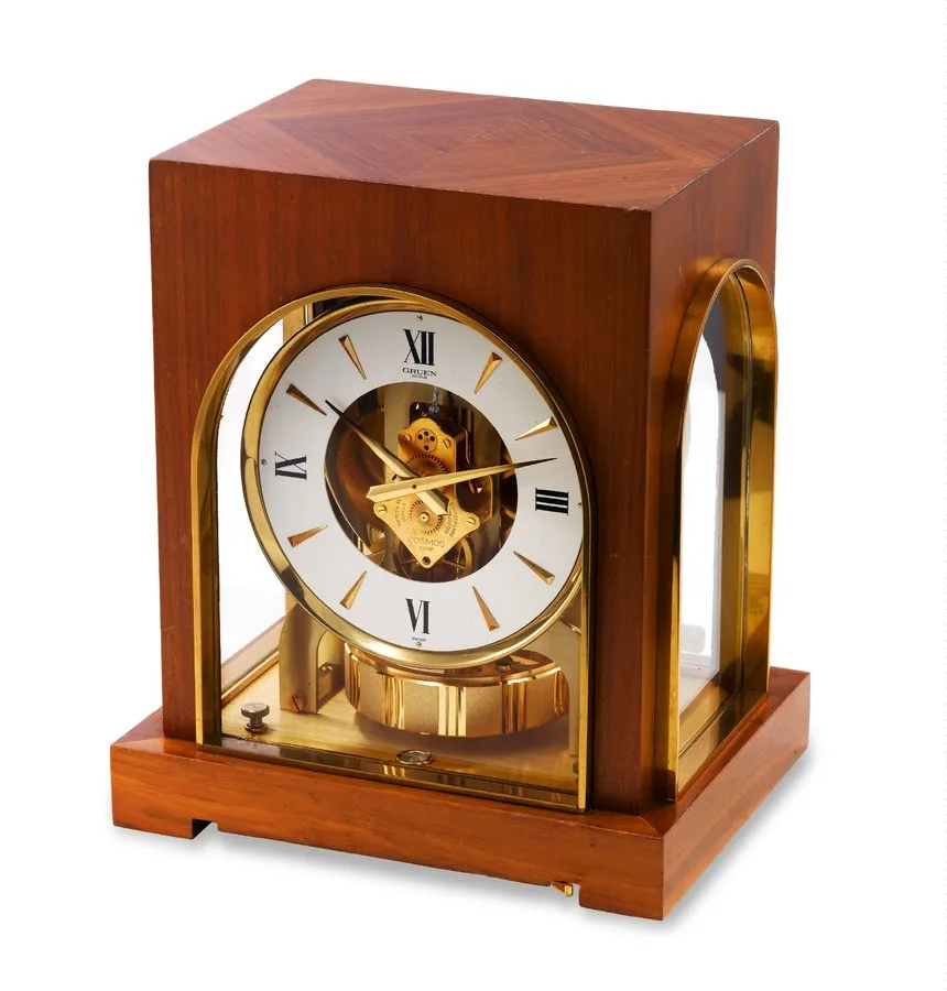 Wooden Atmos Gruen/ Cosmos "Atmos". Made in the 1960's. Fine, rectangular, gilt brass, wood and glass Atmos clock wound by barometric pressure changes.