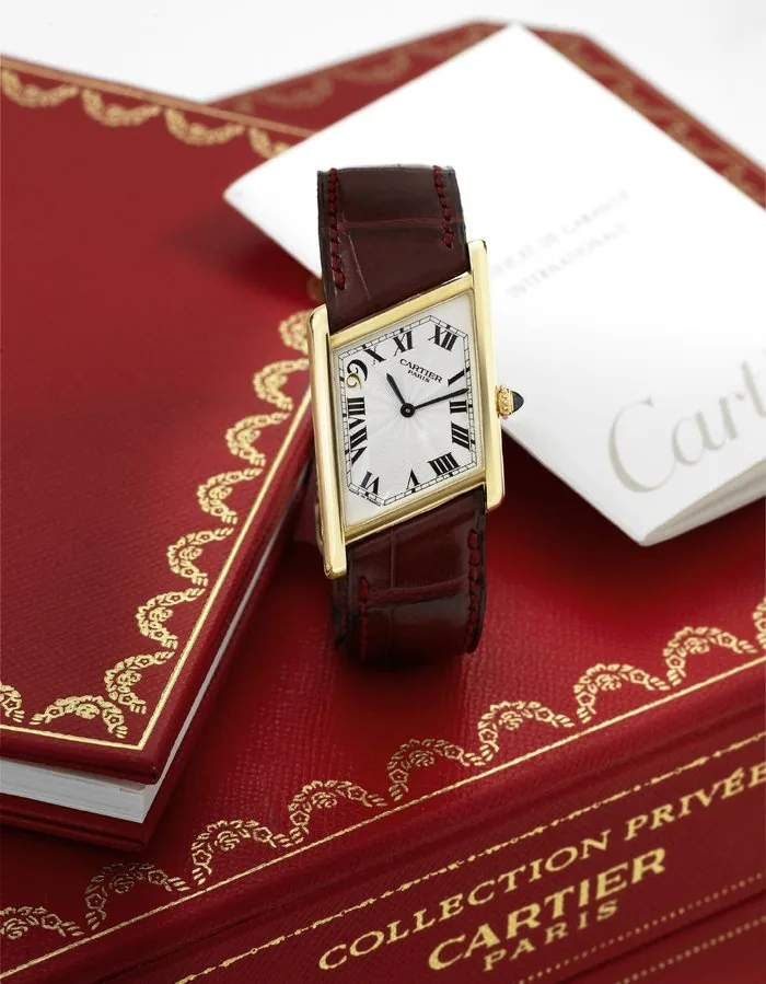 Cartier Tank Parallelogram - Asymmetric - Macau 1999 - Limited Edition Cartier, Paris, Private Collection, Asymmetric Tank, Macau 1999, No. 20/99, Ref. 2488. Made in a limited edition of 99 pieces in 1999 to commemorate the Handover of Macau to the Government of China. Very fine, asymmetric rectangular, 18K yellow gold wristwatch with a Cartier 18K pink gold deployant clasp. Accompanied by the original Cartier box, guarantee (now void) and instruction manual.