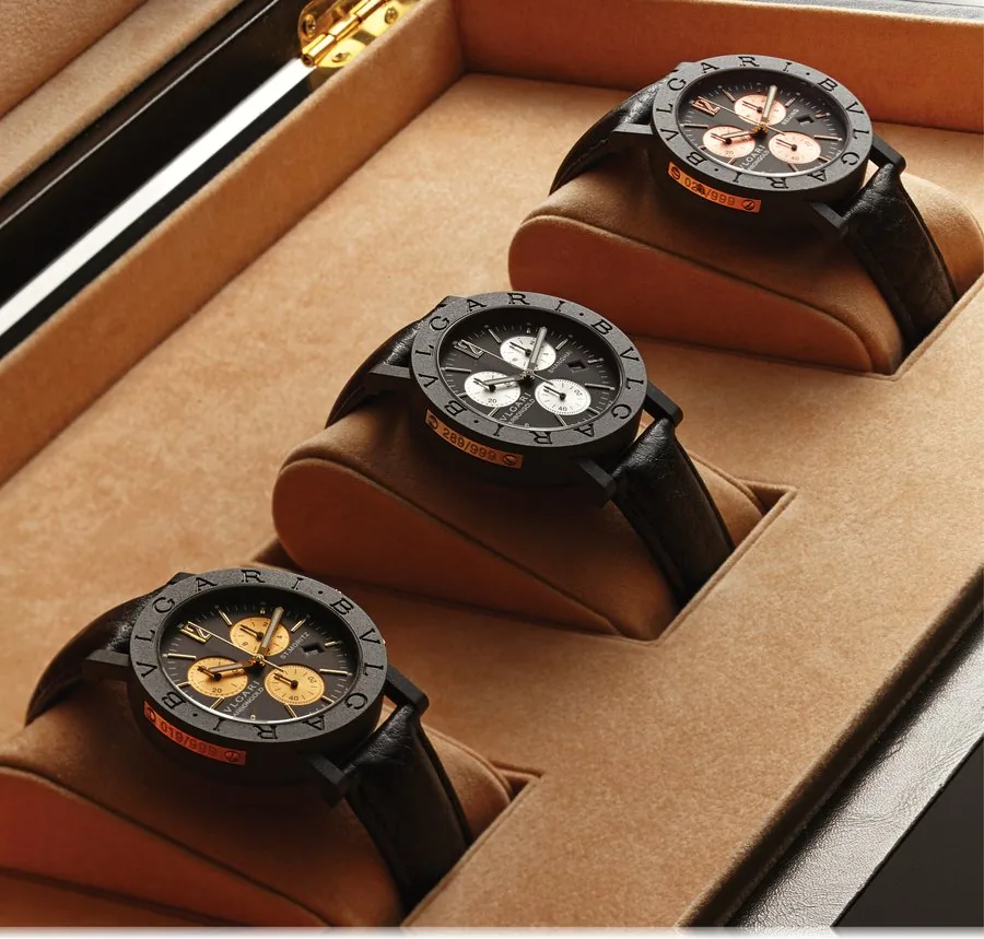 BVLGARI SET OF 3 CHRONOGRAPH CARBON GOLD Bvlgari, "Carbongold Chronograph St Moritz, Shanghai and Beijing"Ref. BB 38 CL CH. Made in a limited edition of 999 examples. Fine, water-resistant, carbon fiber and gold quartz wristwatch with oval-button chronograph, registers, date and Bvlgari carbon fiber and gold buckle. Accompanied by a fitted box, guarantee(now void) and booklet. A) BEIJING No. 021/999. Sold on April 26th, 2005. Carbon fiber and pink gold. B) SHANGHAI No. 289/999. Sold on August 7t