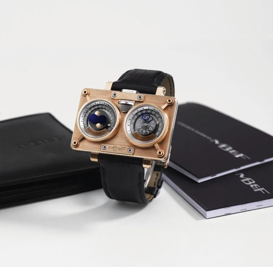 MB &F MB&F, Horological Time Machine No. 2, case A140009, Ref. No. 20. DRRT. Made in a limited edition of 125 pieces in 2010, sold on March 30, 2010. Extremely fine and innovative, oversized, self-winding and manual, water-resistant, 18K pink gold and titanium wristwatch, with instantaneous jumping hour, concentric retrograde minute and date and northern and southern hemisphere moonphase and an MB&F pink gold and stainless steel double-sprung deployant clasp. Accompanied by its original warranty
