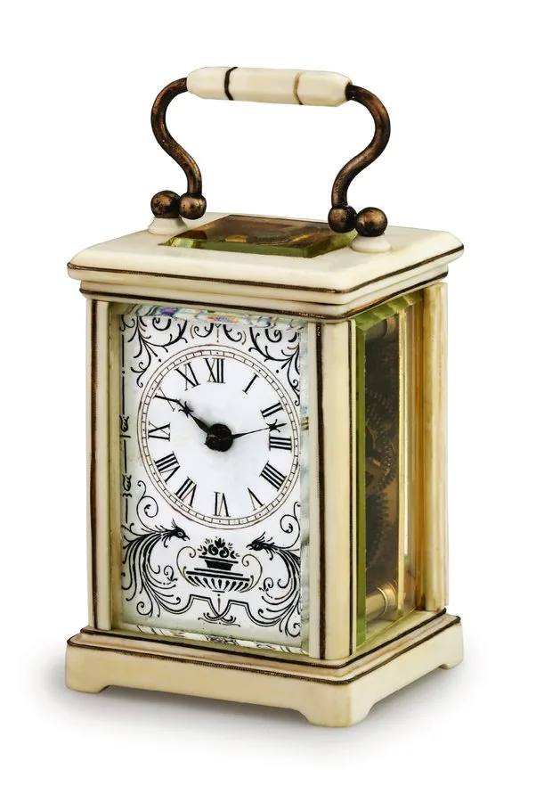 IVORY MINIATURE CARRIAGE CLOCK L. D., France. Made circa 1920. Fine, miniature, ivory-cased, 8-day going carriage clock. To be sold without reserve