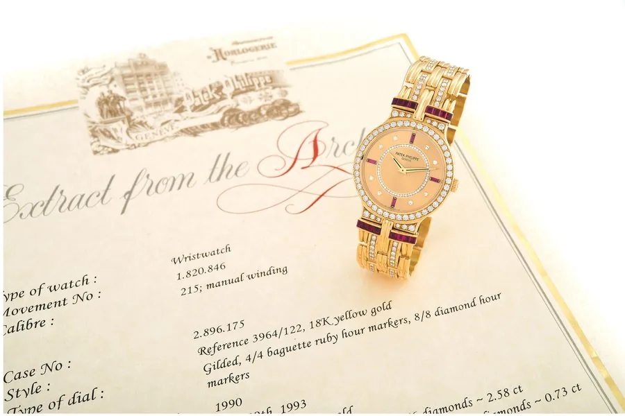 PATEK PHILIPPE, REF. 3964 ' GOLD, DIAMONDS & RUBIES Patek Philippe, Geneve, movement No. 1820846, case No. 2896175, Ref. 3964/122. Made in 1990, sold on July 29th, 1993. Extemely fine and rare, 18K yellow gold, diamond and ruby-set wristwatch with an integral 18K yellow gold and diamond-set Patek Philippe bracelet. Accompanied by the Extract from the Archives.
