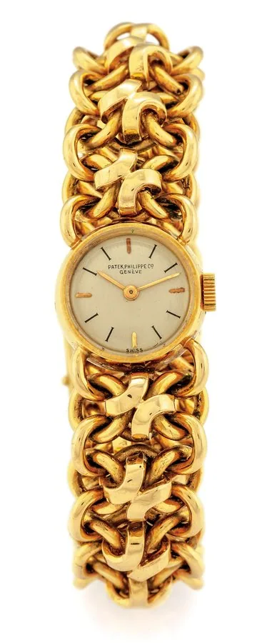 PATEK PHILIPPE LADY'S BRACELET WATCH YELLOW GOLD Patek Philippe & Co, Genève, movement No. 943896, case No. 656816. Made circa 1950. Very fine, rare and elegant, 18K yellow gold lady's bracelet watch with an integral heavy 18K yellow gold Patek Philippe fancy chain-link bracelet with concealed clasp. Dial, case, movement and bracelet signed.