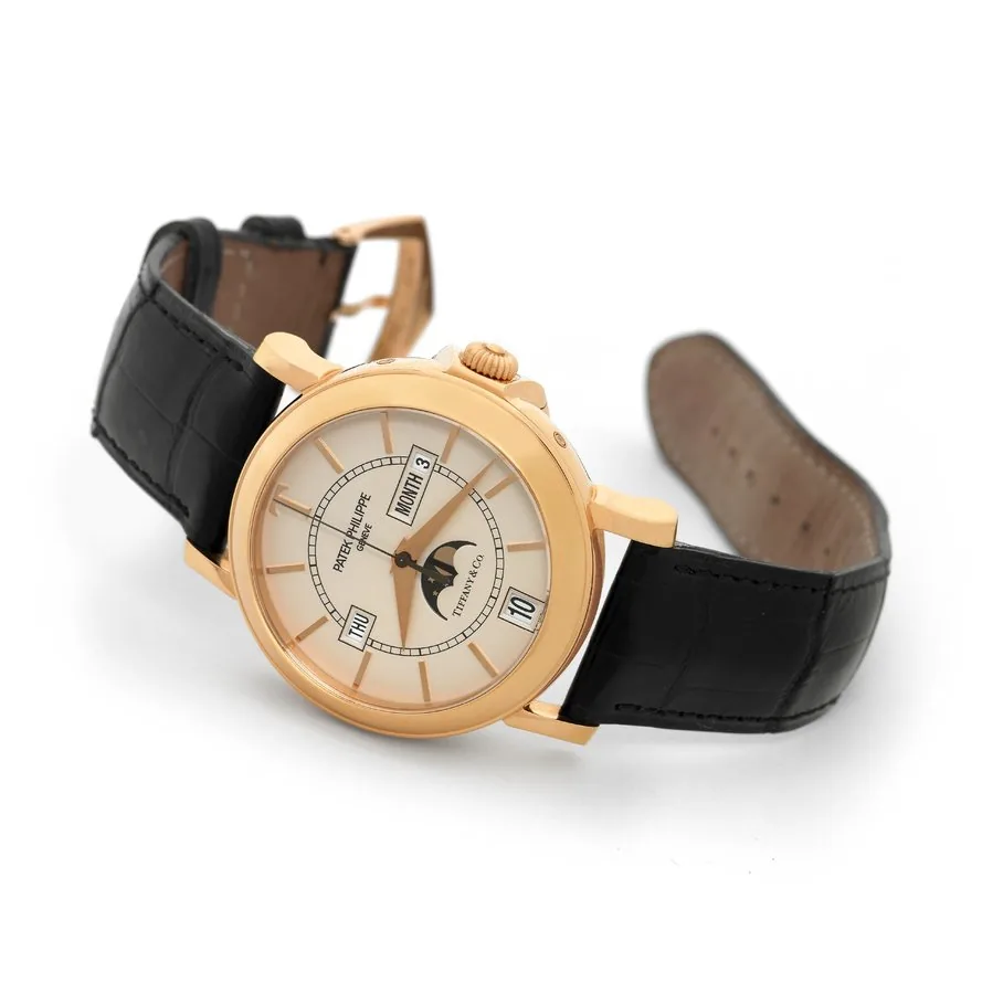 Patek Philippe T 150 - Pink Gold - Retailed by Tiffany & Co. Patek Philippe & Co., No. 3235325, case No. 4171879, Ref. 5150 R, "T-150," Made in a limited edition of 150 pieces in 2001 to commemorate the 150th anniversary of the collaboration between Patek Philippe and Tiffany & Co. Very fine and rare, astronomic, center seconds, self-winding, 18K pink gold wristwatch with semi-instantaneous digital triple date annual calendar, moon phases, 48-hour autonomy and an 18K pink gold Patek Philippe buc