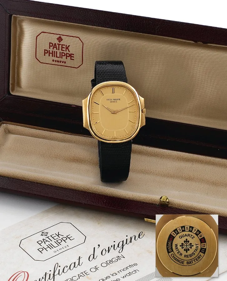 Gold Quartz Nautilus Patek Philippe & Cie, Genève, No. 1507521, Ref. 3770. Made circa 1985. Fine, oval, water-resistant, 18K yellow gold quartz wristwatch with an 18K yellow gold Patek Philippe buckle. Accompanied by a fitted box and Certificate of Origin.