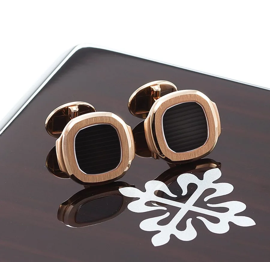 PATEK PHILIPPE NAUTILUS CUFFLINKS PINK GOLD Patek Philippe, Geneve, 'Nautilus'. Made circa 1990. Fine and rare, 18K pink gold pair of cufflinks. Accompanied by a fitted box. In very good overall condition.