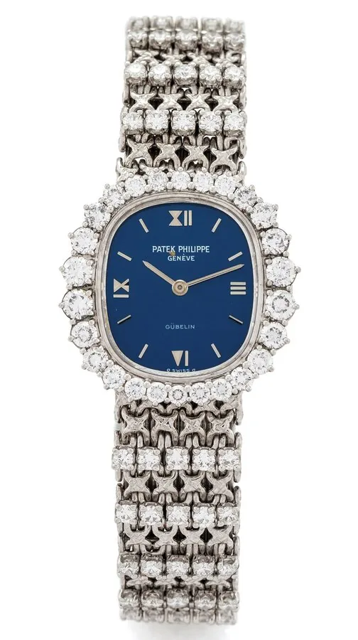 PATEK PHILPPE REF. 4137/1 ELLIPSE WHITE GOLD AND DIAMONDS Patek Philippe, Genève, "Ellipse", retailed by Gübelin, movement No. 1271437, case No. 2752232, Ref. 4137/1. Made circa 1975. Very fine and elegant, 18K white gold and diamond-set lady's wristwatch with an integral 18K white gold and diamond-set Patek Philippe woven bracelet set with 50 diamonds.
