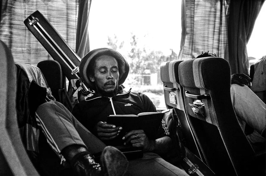 BOB MARLEY, 1980 Reading the Bible SIZE 16" x 20" MEDIUM Archival digital print. VALUE $2,200 - $2,800 STARTING BID $1,725