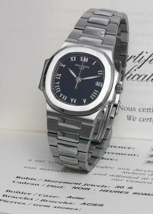 Patek Philippe, Genève, "Nautilus", movement No. 3032161, case No. 4148307, Ref. 3800/1A-001. Sold in March, 2002. Fine, center-seconds, self-winding, water-resistant, carré galbé, stainless steel wristwatch with date and a stainless steel Patek Philippe bracelet with deployant clasp. Accompanied by the Certificate of Origin and a fitted box.
