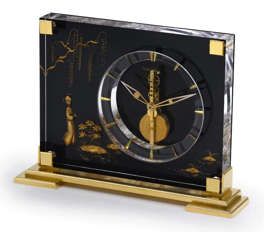 JAEGER-LECOULTRE 'CHINESE' Jaeger-LeCoultre, "Marina", No. 349. Made in the 1960's. Fine, Perspex and gilt brass, 8-day going desk clock with visible movement. To be sold without reserve
