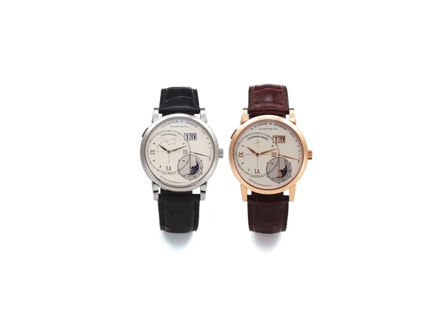SET OF 2 A. LANGE & SÖHNE LUNA MUNDI A. Lange & Söhne, Glashütte i. SA, Lange 1, Luna Mundi, Ursa Major and Southern Cross. No. 49/101. Made in a limited edition of 101 sets in 2003. Accompanied by original fitted box, travel box, guarantee, instruction, booklet, push pin and hang tag. A) Lange 1 Luna Mundi - Ursa Major, No. 39172, case No. 152549, Ref. 119.026, 18K white gold wristwatch with 18K white gold A. Lange & Söhne buckle B) Lange 1 Luna Mundi - Southern Cross, No. 37618, case No. 15234