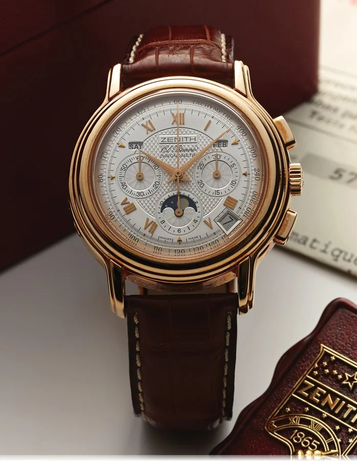 ZENITH EL PRIMERO CHRONOMASTER TRIPLE DATE MOON CHRONOGRAPH PINK GOLD Zenith, El Primero, Chronometre, No. 11511, Ref. 17 0240 410. Made in the 2000s. Very fine, self-winding, water-resistant, 18K pink gold wristwatch with square button chronograph, registers, tachometer, moon phases, triple date calendar and an 18K pink gold Zenith buckle. Accompanied by a Zenith fitted box, guarantee(blank), COSC, setting pin, hang tag and instruction booklet.