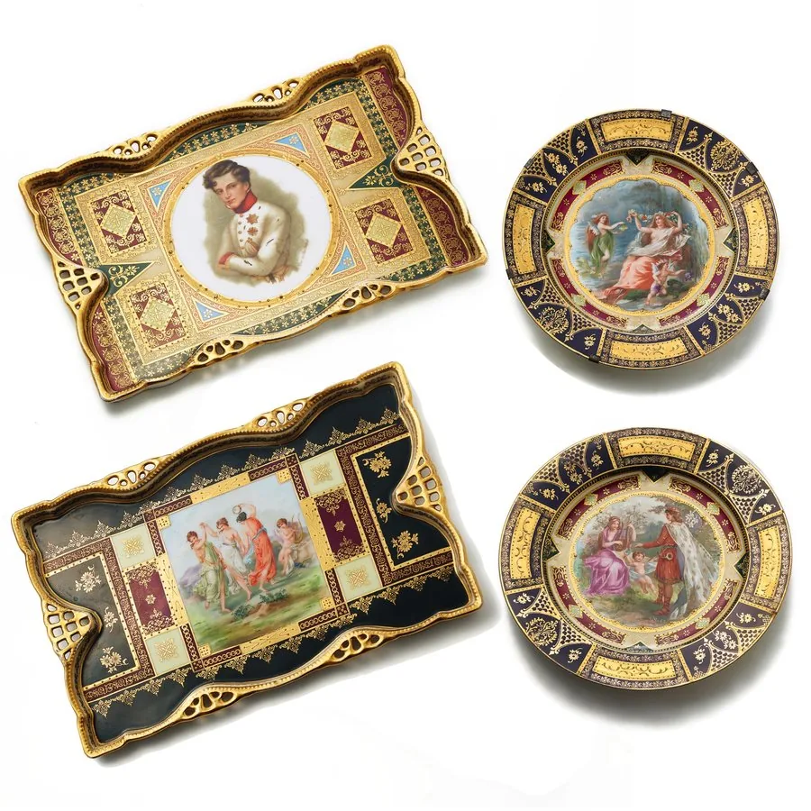 VIENNA ROYAL PORCELAIN FACTORY HAND-PAINTED PLATES Vienna Royal Porcelain Factory, Vienna. Made circa 1740. A set of 4 of hand-painted Austrian porcelain plates: Motifs with goddess surrounded by a cherub and a fairy, a prince courting a lady with a cherub, Napoleon II, and dancing girls and a cherub. In very good overall condition, one with metal wall mounting brackets. VIENNA ROYAL PORCELAIN Manufacture was founded in 1718 as a new porcelain factory by a Dutchman CLAUDIUS INNOCENTIUS DU PAQUIE