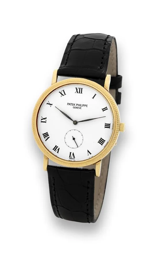Patek Philippe Ref. 3919 Yellow Gold Patek Philippe, Genève, 'Calatrava,' movement No. 1825443, case No. 2898498, Ref. 3919. Made in 1992. Fine and elegant, thin, 18K yellow gold wristwatch with an 18K yellow gold Patek Philippe buckle. Accompanied by a fitted Patek Philippe box and the Extract of the Archives.