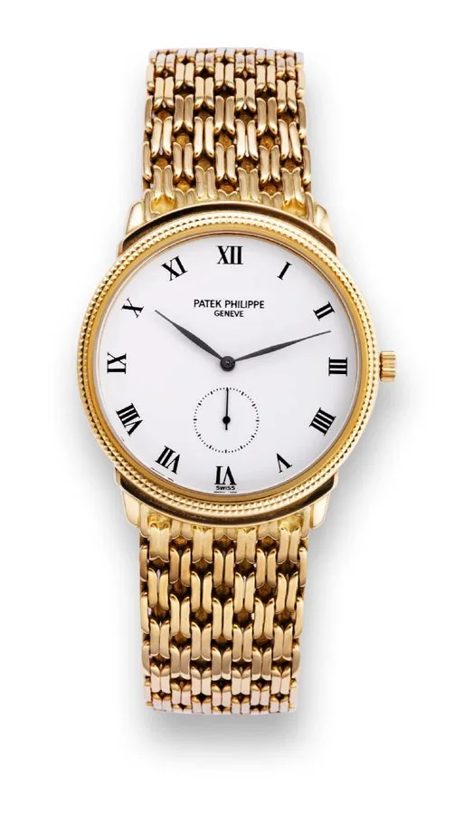Yellow Gold Ref. 3919/020, 'Clous de Paris' Patek Philippe, Genève, movement No. 1828118, case No. 2899390, Ref. 3919/20. Sold on December 26th, 1992. Fine and elegant 18K yellow gold wristwatch with integrated chain-link 18K yellow gold Patek Philippe bracelet. Accompanied by the original Patek Philippe box and certificate of origin.