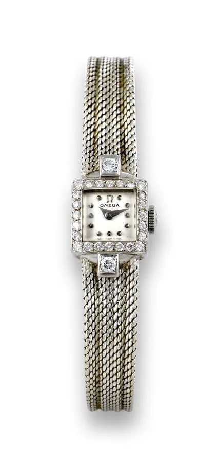 Omega White Gold & Diamonds Omega, movement No. 12384537, case No. 10816168. Made in the 1950s. Fine and elegant, diamond-set 18K white gold lady's wristwatch with an 18K white gold integral bracelet. To be sold without reserve