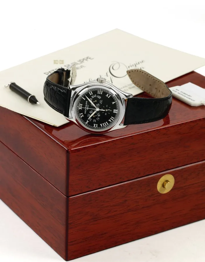 Ref. 5035 Platinum Annual Calendar Patek Philippe, Genève, No. 3131473, case No. 4077417, Ref. 5035 P. Made in 2002, sold October 10th, 2003. Very fine, center seconds, self-winding, water-resistant, platinum wristwatch with annual calendar and a platinum Patek Philippe buckle. Accompanied by the original mahogany presentation box, setting pin and Certificate of Origin.