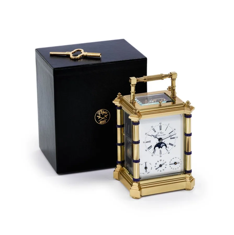 L'EPEE, BAMBOU LIMITED EDITION CARRIAGE CLOCK WITH CALENDAR, MOON PHASES & ALARM L'Epée, France, No.032/100. Made in a limited edition of 100 examples in the late 20th century. Fine, gold-plated and lapis lazuli, 8-day going, hour and halfhour striking, repeating carriage clock with day-date calendar, alarm, moon phases and lunar calendar. Accompanied by a fitted L'Epée box and key.