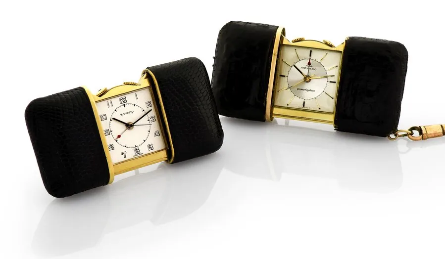 MOVADO ' TWO ALARM PURSE WATCHES 'ERMETOPHON' Movado, Swiss, 'Ermetophon', No. 4321 & 13134. Made in the 1950s. Fine, two skin-covered, keyless, brass "Ermeto" purse watches with alarm and an easel to use as a desk clock. To be sold without reserve