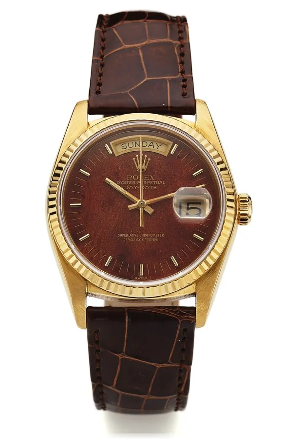 ROLEX REF. 18038/18000 DAY-DATE MAHOGANY DIAL YELLOW GOLD Rolex, Oyster Perpetual, Day-Date, Superlative Chronometer Officially Certified, case No. 5535127, Ref. 18038/18000. Made in 1978. Very fine, center-seconds, self-winding, water-resistant, 18K yellow gold wristwatch with mahogany dial, day and date with a Rolex buckle. Accompanied by a box.