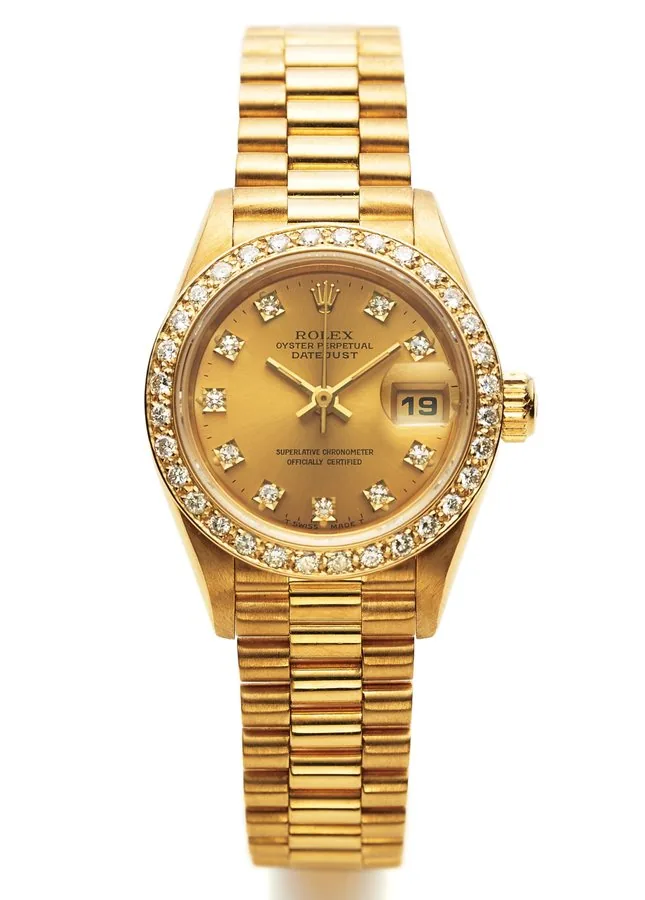 ROLEX REF. 69138 DATEJUST LADY'S DIAMOND YELLOW GOLD Rolex "Date Just", case No. N272903, Ref. 69138. Made circa 1991. Very fine and rare, center-seconds, self-winding, water-resistant, 18K yellow gold and diamonds lady's wristwatch with date and Rolex 18K yellow gold bracelet.