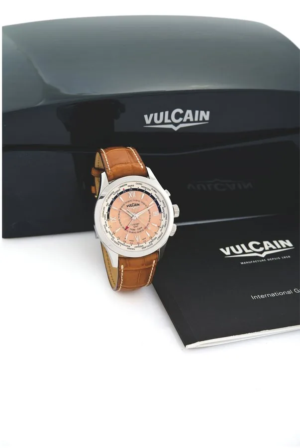 VULCAIN CRICKET GMT Vulcain, Swiss, 'Cricket GMT', No. 105, Ref. 100108.143. Made circa 2008. Fine, world-time, water-resistant, stainless steel wristwatch with alarm, centerseconds, 24-hour day and night indication and a leather strap with stainless steel double deployant clasp. Accompanied by the warranty, fitted box and instructions. To be sold without reserve