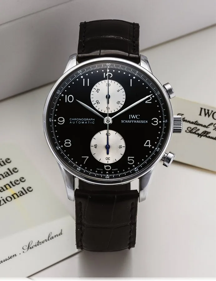 IWC REF. 3714 PORTUGUESE CHRONOGRAPH AUTOMATIC STEEL International Watch Co., Schaffhausen, "Portuguese Chronograph Automatic", case No. 2697565, Ref. 3714. Made circa 1998. Very fine, large, self-winding, water-resistant, stainless steel wristwatch with round button chronograph, register and a stainless steel IWC buckle. Accompanied by a fitted box, instruction booklet, inter-national guarantee, hang tag and booklets.