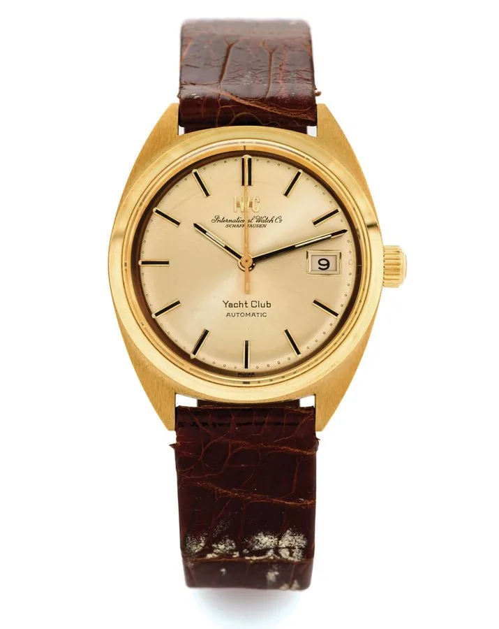 IWC YACHT CLUB, 18K GOLD, NOS International Watch Co., Schaffhausen, "Yacht Club, Automatic", movement No. 2149595, case No. 2138295, Ref. 1811. Made circa 1975. Fine and very rare, tonneau-shaped, center seconds, selfwinding with "Pellaton" system, water-resistant, 18K yellow gold wristwatch with date and a gold plated IWC buckle.