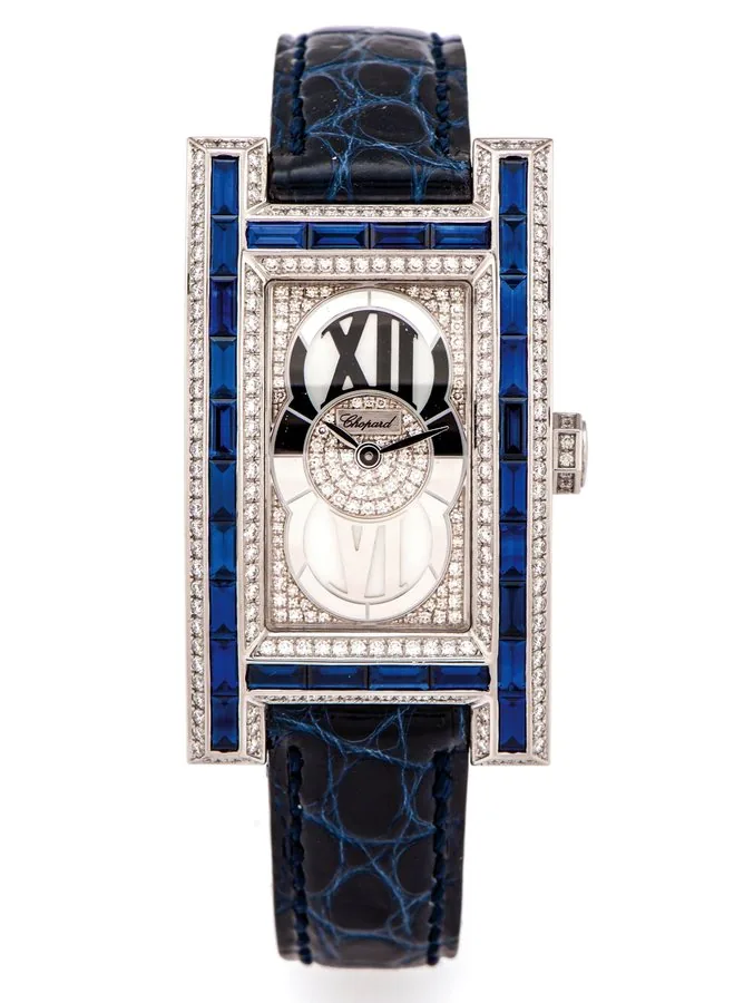 CHOPARD BAGUETTE SAPPHIRE DIAMONDS WHITE GOLD Chopard, Geneve, case No. 571553, Ref. 773 1. Very fine and elegant, 18K white gold & baguette sapphire, diamond, rectangular quartz wristwatch with an 18K white gold Chopard deployant clasp.