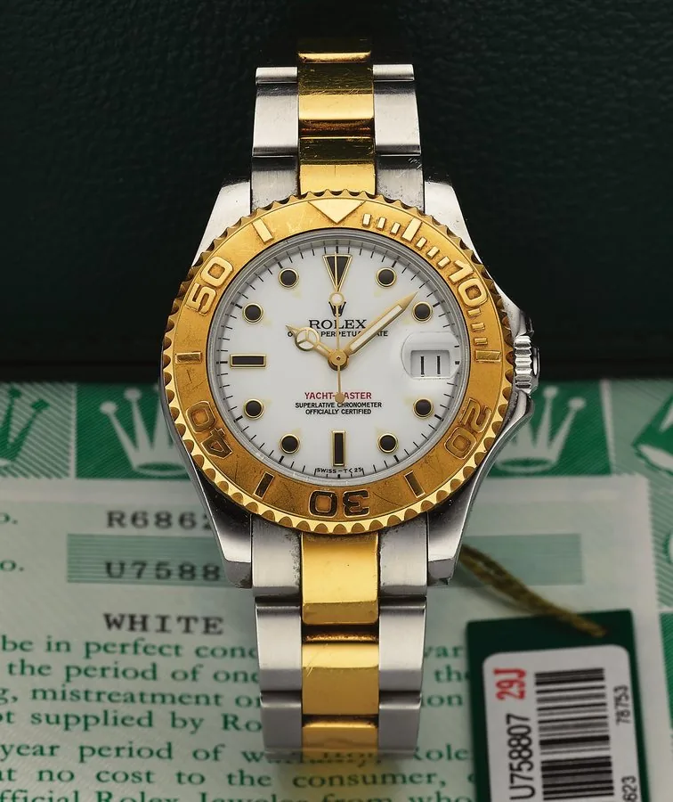 ROLEX REF. 68623 YACHT MASTER MID-SIZE STEEL AND GOLD Rolex, Oyster Perpetual Date, Yacht-Master, Superlative Chronometer, Officially Certified, case No. U758807, Ref. 68623. Made in 1997. Very fine, center seconds, self-winding, water-resistant, stainless steel and 18K yellow gold wristwatch with special time-lapse bezel, date and a stainless steel and 18K yellow gold Rolex Oysterlock bracelet Ref. 78753. Accompanied by the fitted box, guarantee (now void), hang tag, booklets and extra link.