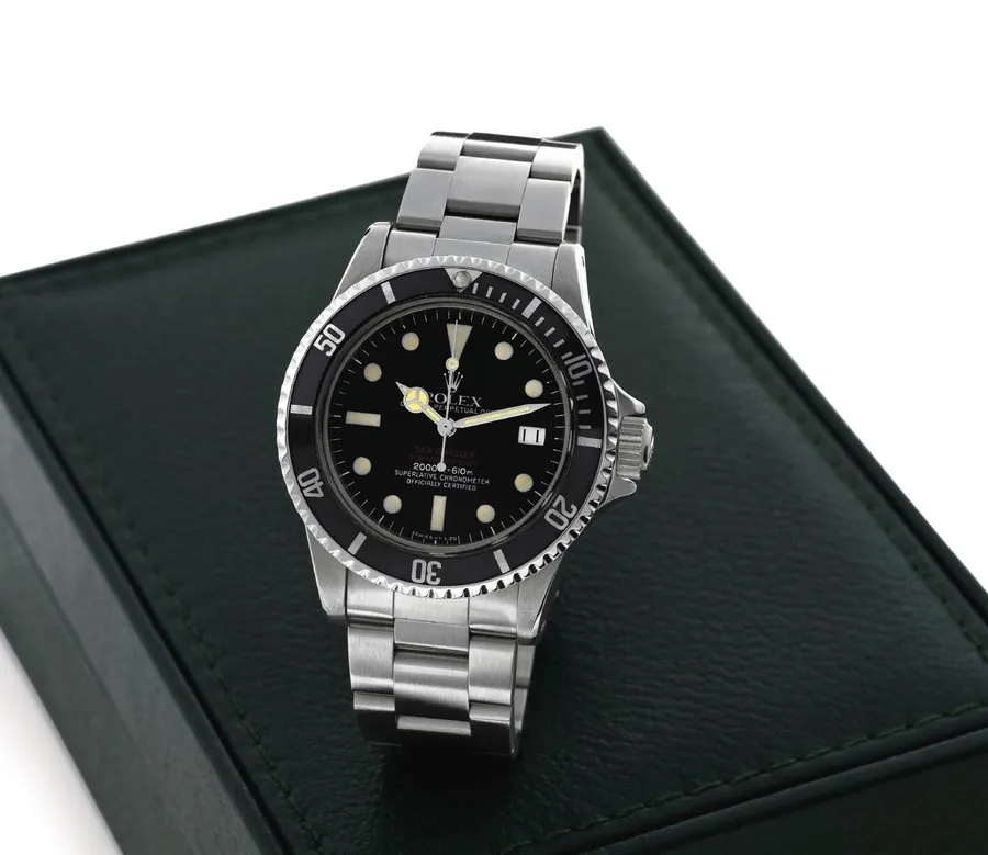 ROLEX REF. 1665, DOUBLE RED SEA-DWELLER MARK IV Rolex, 'Oyster Perpetual Date, Sea-Dweller, Submariner 2000, 2000 ft./610 m., Superlative Chronometer, Officially Certified', case No. 4208871, Ref. 1665. Made in 1976. Fine and rare, center seconds, self-winding, water resistant, stainless steel diver's chronometer wristwatch with double red Sea-Dweller logo, helium escape valve, date and a stainless steel Rolex Oyster Ref. 93150 Fliplock bracelet. Accompanied by box. To be sold without reserve