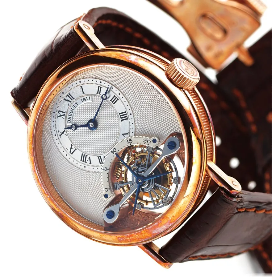 BREGUET TOURBILLON PINK GOLD Breguet, Brevet du 7 Messidor An 9, "Tourbillon No. 60", No. 1411 H, Ref. 3350. Made in the 1990's. Very fine and rare, 18K pink gold wristwatch with visible one-minute tourbillon regulator and an 18K pink gold Breguet deployant clasp. Accompanied by a box and certificate.