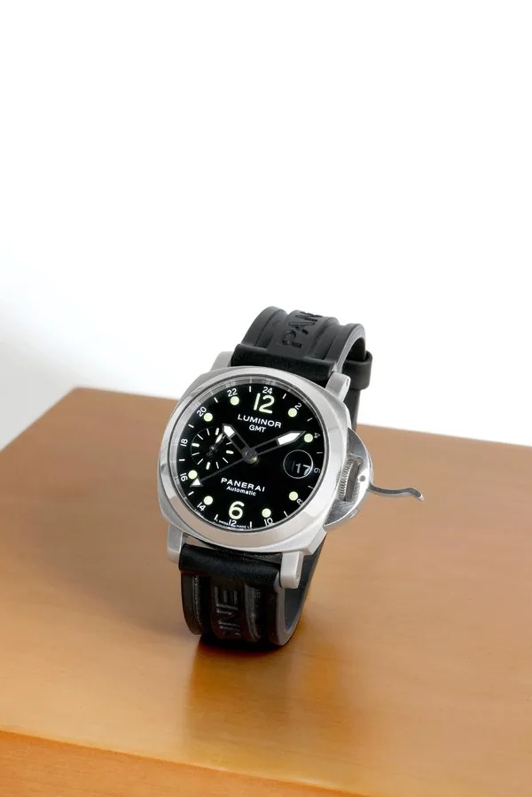 Officine Panerai PAM 159,'Luminor GMT ' Officine Panerai, Firenze 1860, "Luminor GMT, Panerai Automatic", No. F0780/1700, case No. BB1100230, Ref. OP 6594. Made in a limited series of 1700 pieces in 2003. Fine, large, cushion-shaped, self-winding, water-resistant, stainless steel military diver's wristwatch with two time zones, date, special 24-hour dial and hand and a stainless steel Panerai double deployant clasp. Accompanied by a fitted wooden box.