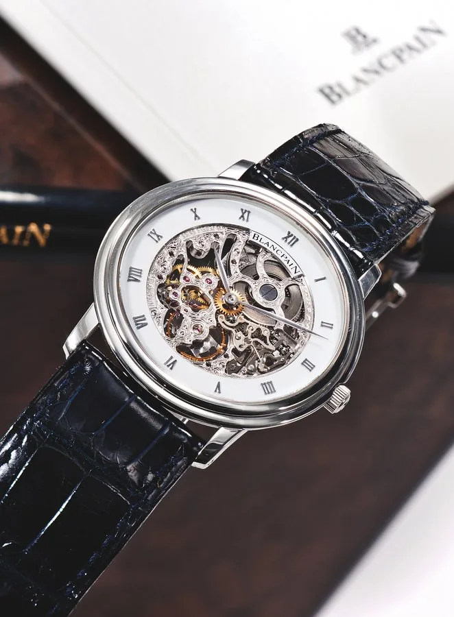 BLANCPAIN, SKELETONIZED VILLERET, PLATINUM Blancpain, 'Villeret', No. 80. Made in the 1990's. Very fine and elegant, thin, skeletonized, platinum wristwatch with a platinum Blancpain buckle. Accompanied by a box and guarantee(blank).