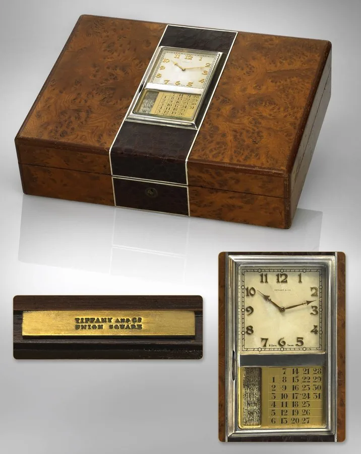 TIFFANY & CO CIGAR BOX Tiffany & Co., No. 8876. Made circa 1935. Fine and rare, burl-wood, alligator, silver and silver gilt cigar box with clock and calendar.