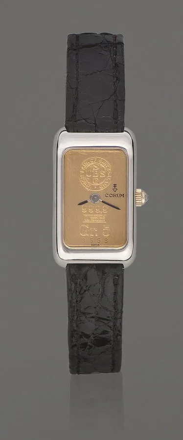 CORUM REF. 14300 UBS INGOT GR. 5 WHITE GOLD Corum, Swiss, Gr. 5 ingot, case No. 3370936, Produced circa 1975. Very fine, rectangular 18K white gold lady's wristwatch, with crown set with diamond cabochon and stainless steel Corum buckle. To be sold without reserve
